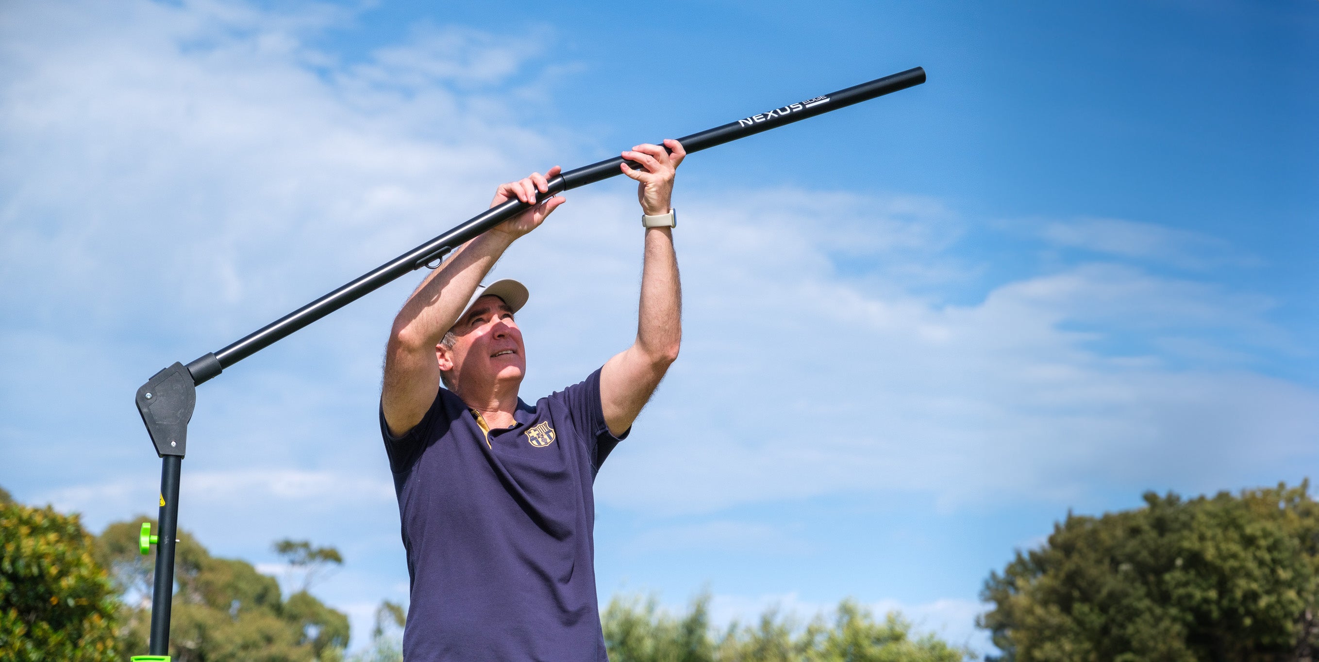 A person sets up the Nexus Edge on an oval