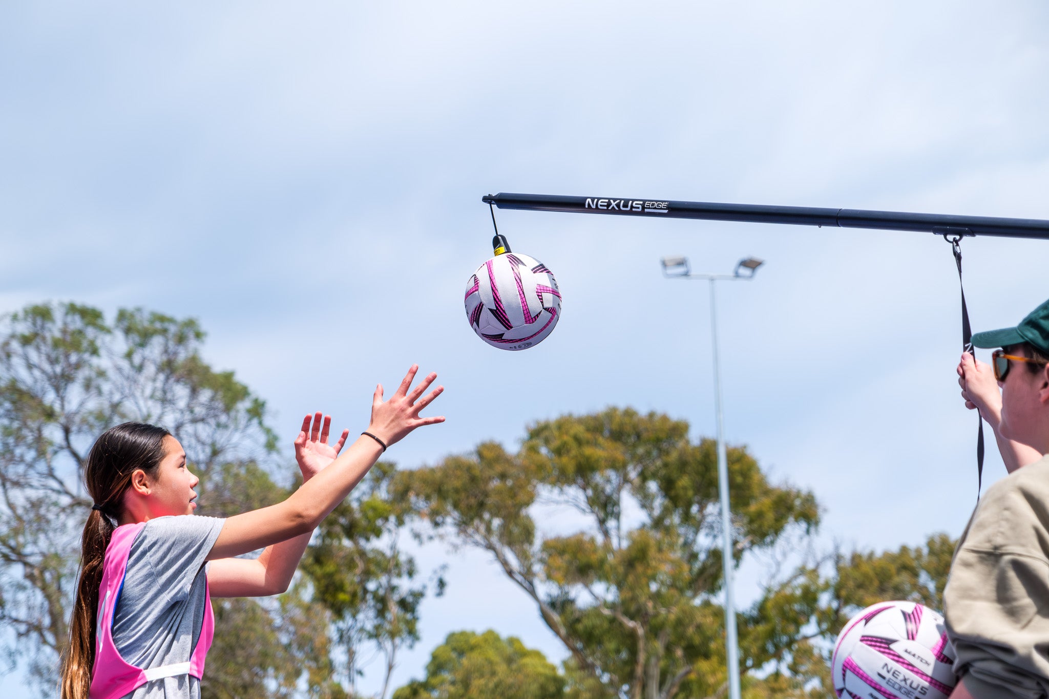 Children practise their netball skills using the Nexus Edge