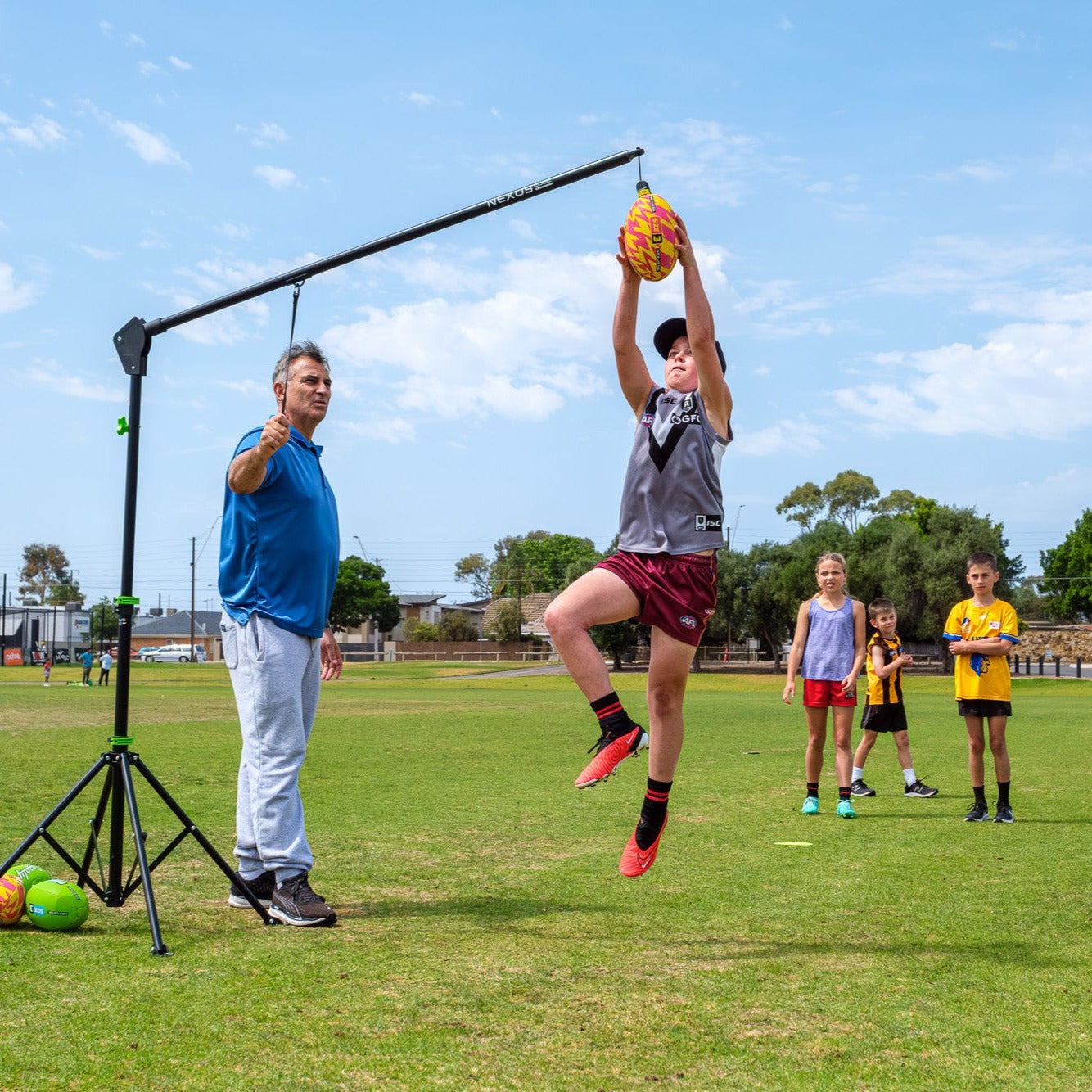 Children practise their AFL marking skills using the Nexus Edge