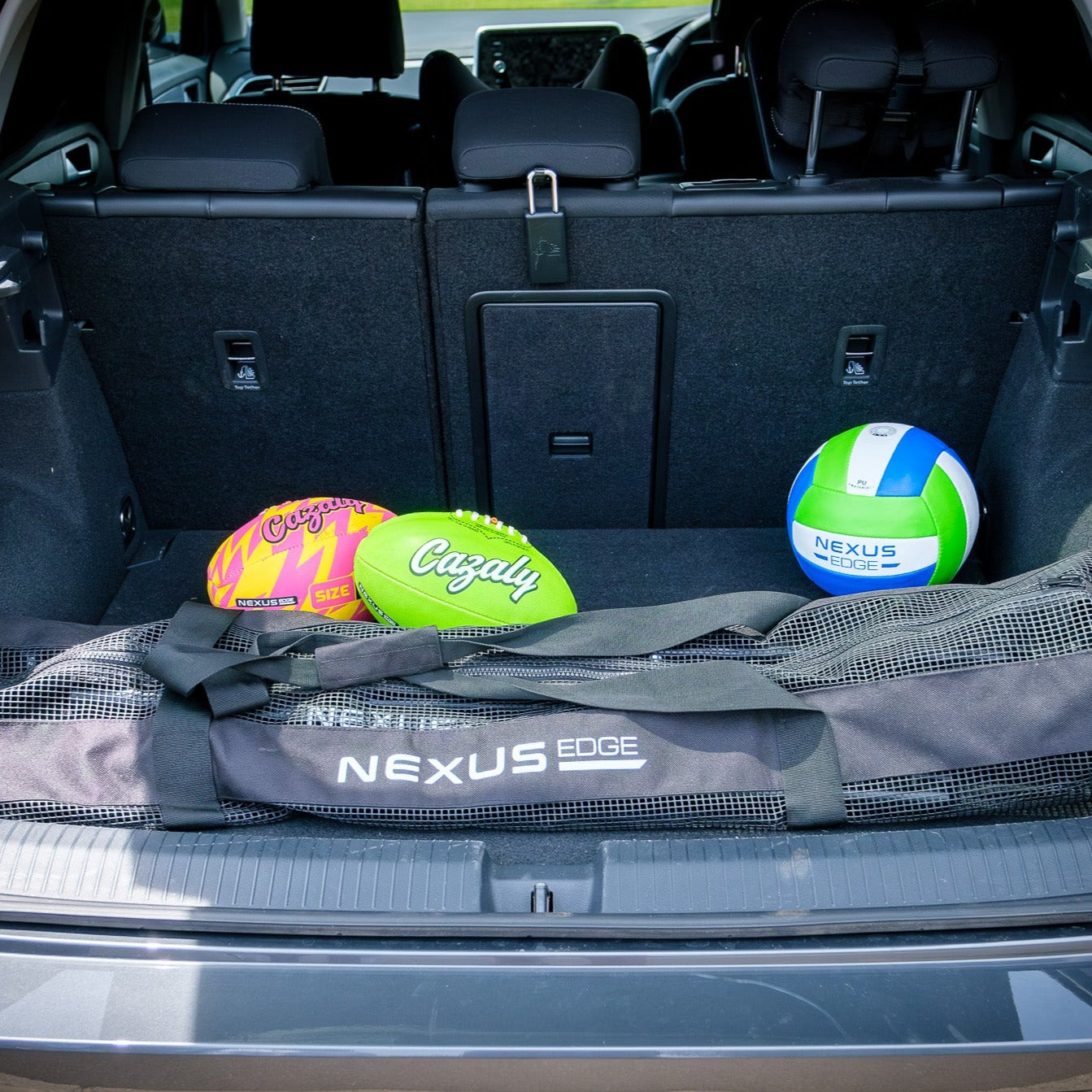 Nexus Edge balls and carry bag packed in the rear of a vehicle